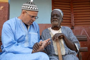 Two men praying together