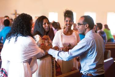 People standing in a circle and talking