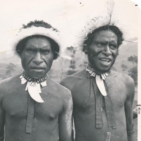 men and women listening, in a classroom setting